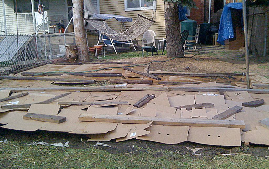 Jonathan Brodsky photo                                Using cardboard to block sunlight is a key part of preparing a no-till gardening bed.