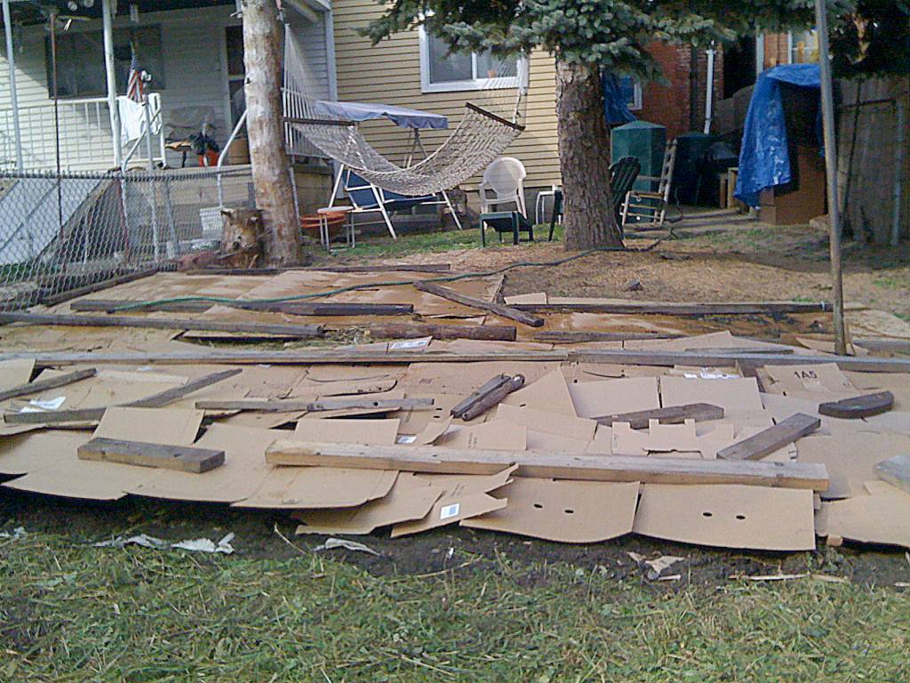 Jonathan Brodsky photo                                Using cardboard to block sunlight is a key part of preparing a no-till gardening bed.