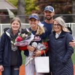 DAN HAMMOCK | GRAYS HARBOR NEWS GROUP                                Britney Patrick from Pe Ell-Willapa Valley stands on the pitchers mound with her parents as seniors were honored at Montesanos softball game Wednesday. Just minutes earlier she signed her letter-of-intent to play for St. Martins University.