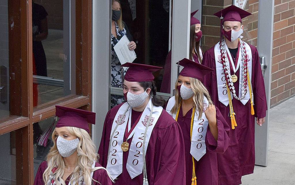 DAN HAMMOCK | GRAYS HARBOR NEWS GROUP                                 Members of the Montesano High School Class of 2020 staged in Bo Griffith Memorial Gym before heading out to take their socially-distanced seats on Jack Rottle Field in Saturdays graduation ceremony.