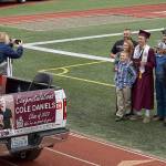DAN HAMMOCK | GRAYS HARBOR NEWS GROUP                                 After getting their diplomas, Montesano High School graduates posed for photos with their families, who lined the track at Jack Rottle Field in their vehicles during the ceremony.