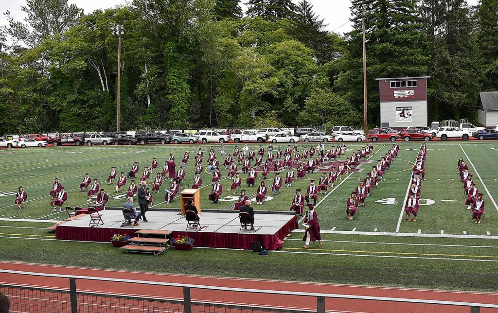 DAN HAMMOCK | GRAYS HARBOR NEWS GROUP                                 Vehicles containing the family members of the Montesano High School Class of 2020 lined the track at Jack Rottle Field Saturday to watch their kids graduate.