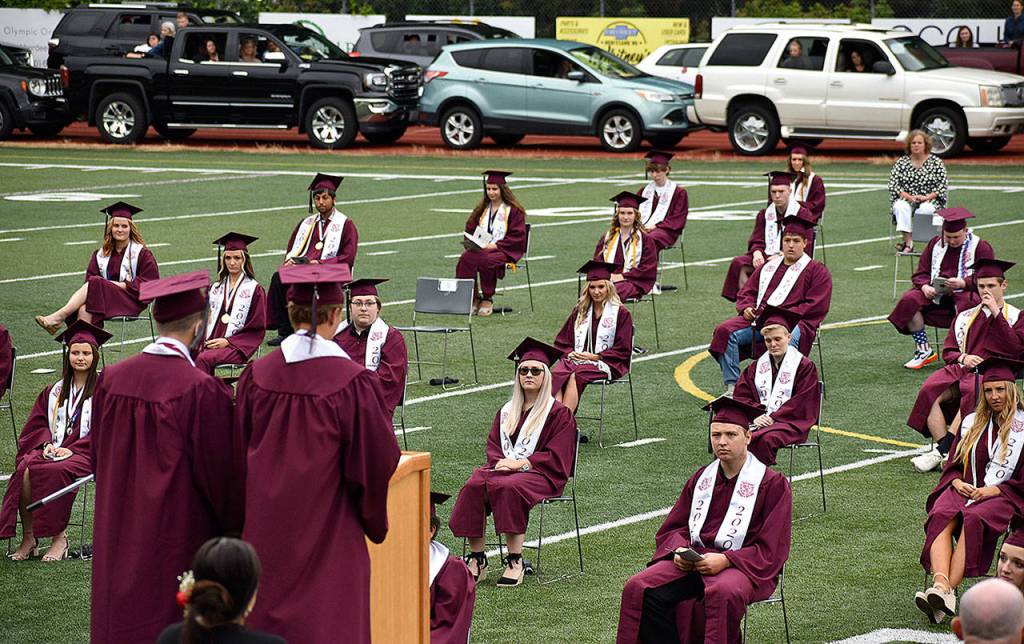 DAN HAMMOCK | GRAYS HARBOR NEWS GROUP                                 Cole Daniels and Braden Dohrmann deliver the valedictorian address at the Montesano High School graduation ceremony at Jack Rottle Field Saturday.