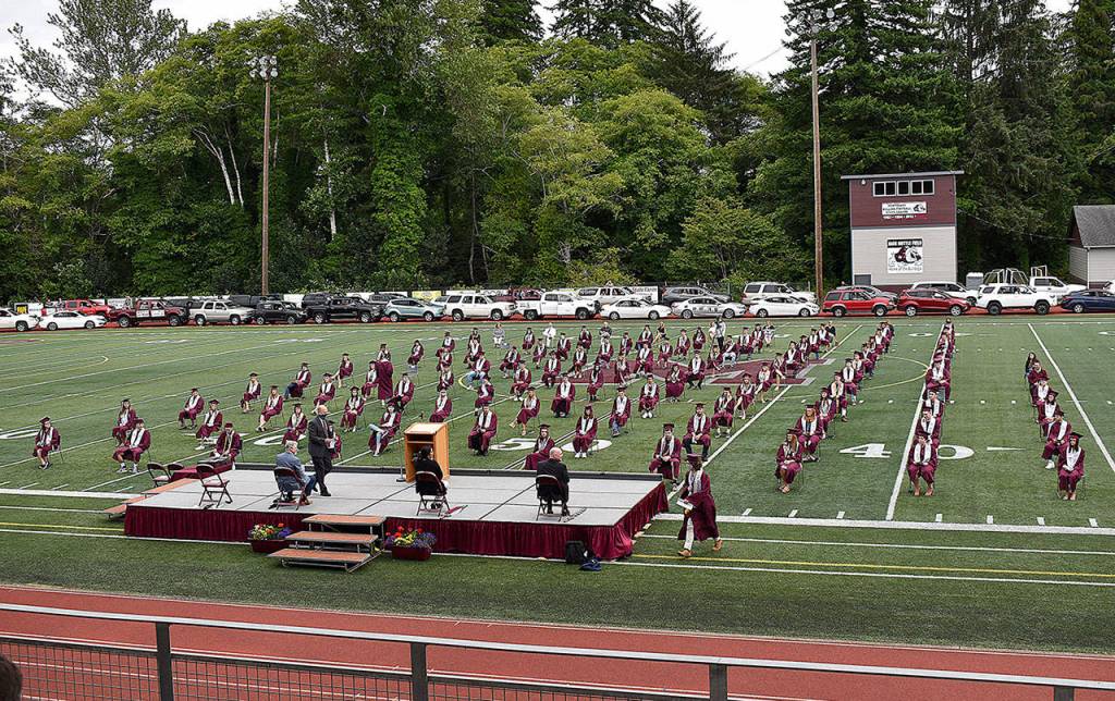 DAN HAMMOCK | GRAYS HARBOR NEWS GROUP                                 Vehicles containing the family members of the Montesano High School Class of 2020 lined the track at Jack Rottle Field Saturday to watch their kids graduate.