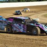 Dave Howard (86) rounds a corner with a trail of competitors behind him in a Modified class race on Saturday at Grays Harbor Raceway in Elma. (Photo by AR Racing Videos)