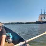Heather (Margot) Longfellow rows in Grays Harbor while sharing the waters with the Lady Washington in late July. (Ryan Hashagen photo)