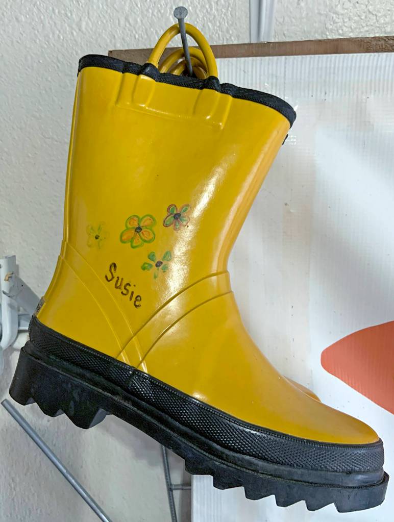 Kat Bryant | Grays Harbor News Group                                The Cosmopolis Volunteer Fire Department named SusanMarie an honorary firefighter after her first fundraiser 14 years ago and gave her these boots.