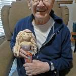 Arnold Samuels holds a mermaid doll he received during his surprise 95th birthday party at the Ocean Shores Senior Center last year. Hes always loved mermaids, said longtime friend Betsy Seidel. (Photo courtesy Betsy Seidel)