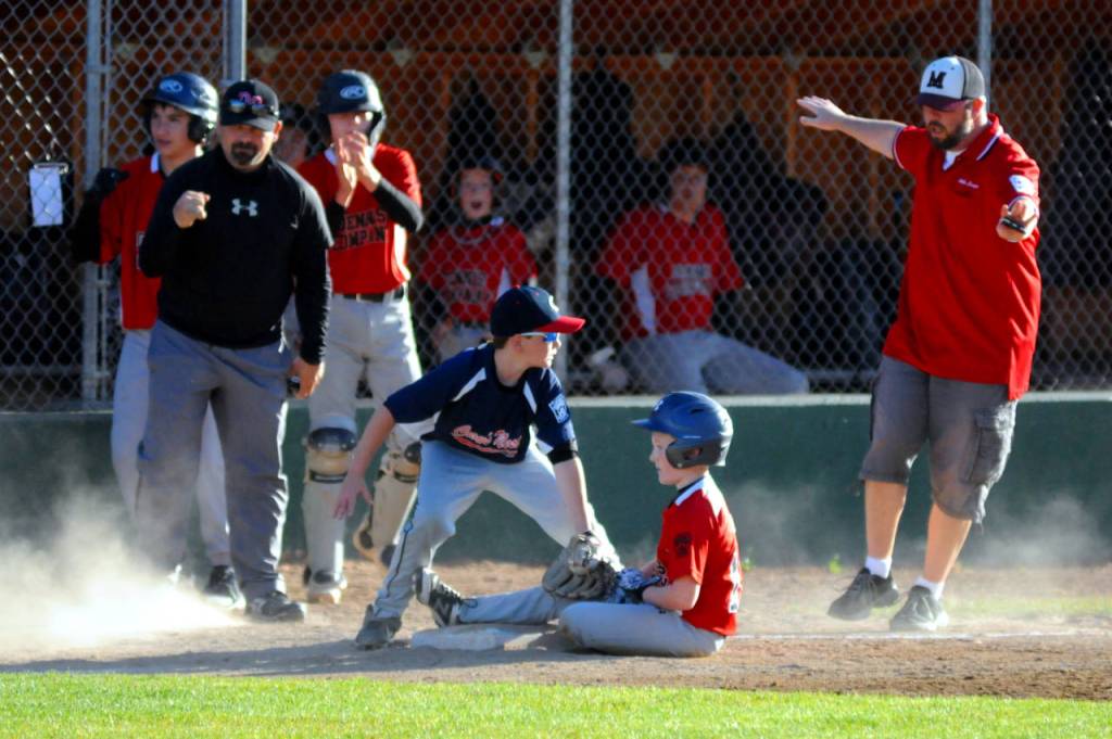 Dennis Companys Alex Salstrom slides in safely to third after hitting a triple during Montesano Little Leagues Majors Division Championship game on Tuesday at Nelson Field in Montesano. (Ryan Sparks | Grays Harbor News Group)