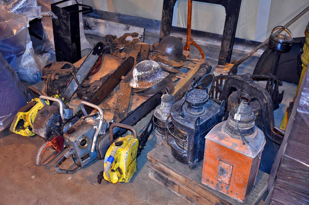 Dan Hammock | Grays Harbor News Group                                 Chain saws, rigging and tin hats are among the logging equipment salvaged from the 2018 Aberdeen Museum of History fire.