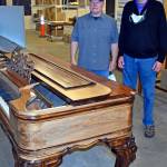 Dan Hammock | The Daily World                                 Aberdeen Museum Board President John Shaw, left, and Tom Quigg next to the piano originally owned in the late 1800s by Carl S. and Belle Weatherwax. Quigg donated the piano to the museum.