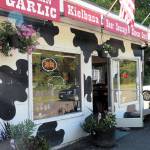 The cow-spotted building is at a wide spot on State Route 105 near Westport. (Doug Barker | For Washington Coast Magazine)