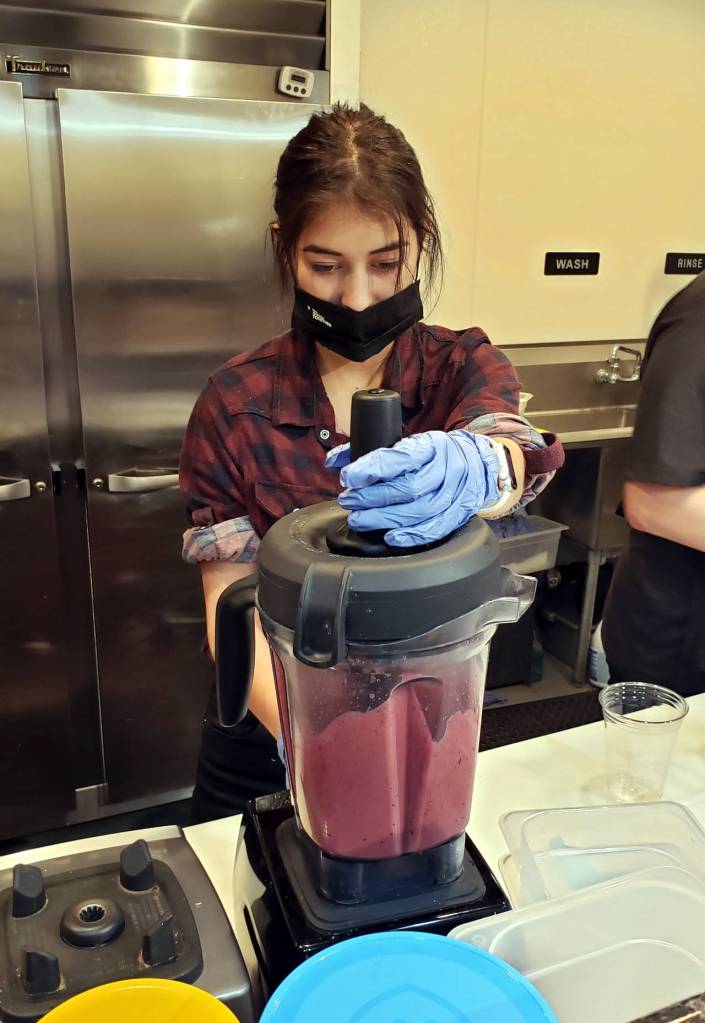 Urban Juice Factory Katherine Streifel blends a smoothie on Tuesday. The business will be closed until late September as plans to upgrade are underway. (Ryan Sparks | The Daily World)