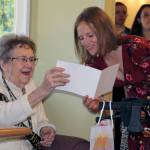 Photo by Dee Anne Shaw                                Ruth McCausland receives a 100th birthday card from granddaughter Meghan McCausland in July 2019.