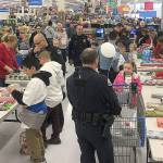 FILE PHOTO                                 Last years Shop with a Cop had about 60 kids and law enforcement from around the county buying and wrapping gifts at Walmart. This years event has been canceled due to COVID-19, but the Hoquiam Police Department is working on plans for a modified event to help local families in need.