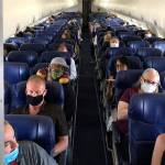Masked passengers fill a Southwest Airlines flight from Burbank, California, to Las Vegas on June 3 with middle seats left open. (Christopher Reynolds/Los Angeles Times)