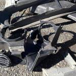 DAN HAMMOCK | THE DAILY WORLD Various Volvo remains after an early morning one-car wreck on State Street that sheared off two city light poles Wednesday.