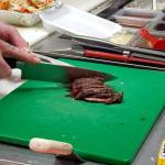 A Pub Monte cook prepares a dish for a customer on Wednesday in Montesano. (Ryan Sparks | The Daily World)