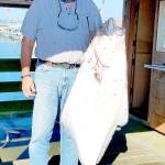 COURTESY WESTPORT WEIGHMASTER Keith Nelson from Tulalip with his Westport Charterboat Association derby-winning halibut, a 63.9-pounder caught Aug. 13 from the charterboat Angler.