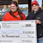 DAN HAMMOCK | THE DAILY WORLD Robert Insley of East Wenatchee, left, picked up his $10,000 check for the largest Chinook weighed in the 2020 Westport Charterboat Association derby Saturday. With him is charterboat Predator captain Derek Gochanour.