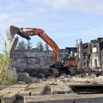 DAN HAMMOCK / The Daily WorldCrews from Rognlins tear down the southeast walls of the Aberdeen Armory building on East Third Street in Aberdeen on Oct. 28, 2019. The building, which burned June 9, 2018, is the former home of the Aberdeen Museum of History.