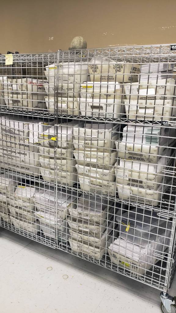 A full cage of processed ballots sits locked away in the Grays Harbor County Elections Office. County Auditor Joesph MacLean predicts he will see upwards of 90% turnout once all the votes are counted. (Ryan Sparks | The Daily World)