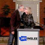 Gov. Jay Inslee kisses his wife Trudi after she introduced him following the Associated Press declaring him a winner for a third consecutive term.   This on the porch of official residence on Tuesday Nov. 3, 2020. (Alan Berner/Seattle Times/TNS)