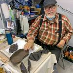 Kat Bryant | The Daily World 
Richard Young enjoys building abstract pieces with alternative clays. Here, hes working with plum black slabs.