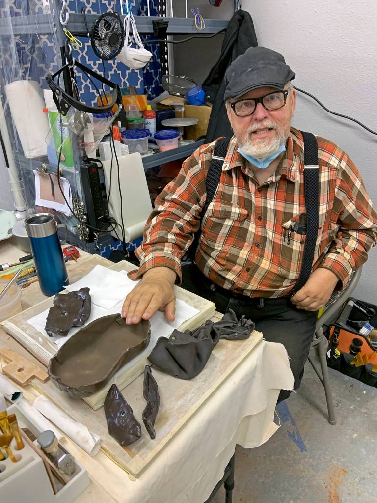 Kat Bryant | The Daily World 
Richard Young enjoys building abstract pieces with alternative clays. Here, hes working with plum black slabs.