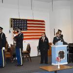 DAN HAMMOCK | THE DAILY WORLD 
The presentation of the colors at the Aberdeen VFW post Wednesday, Veterans Day. At the podium are auxiliary president Jo Ann Wadsworth and post commander Anthony Magri, who served in the Navy for 25 years.