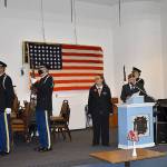 DAN HAMMOCK | THE DAILY WORLD 
The presentation of the colors at the Aberdeen VFW post Wednesday, Veterans Day. At the podium are auxiliary president Jo Ann Wadsworth and post commander Anthony Magri, who served in the Navy for 25 years.