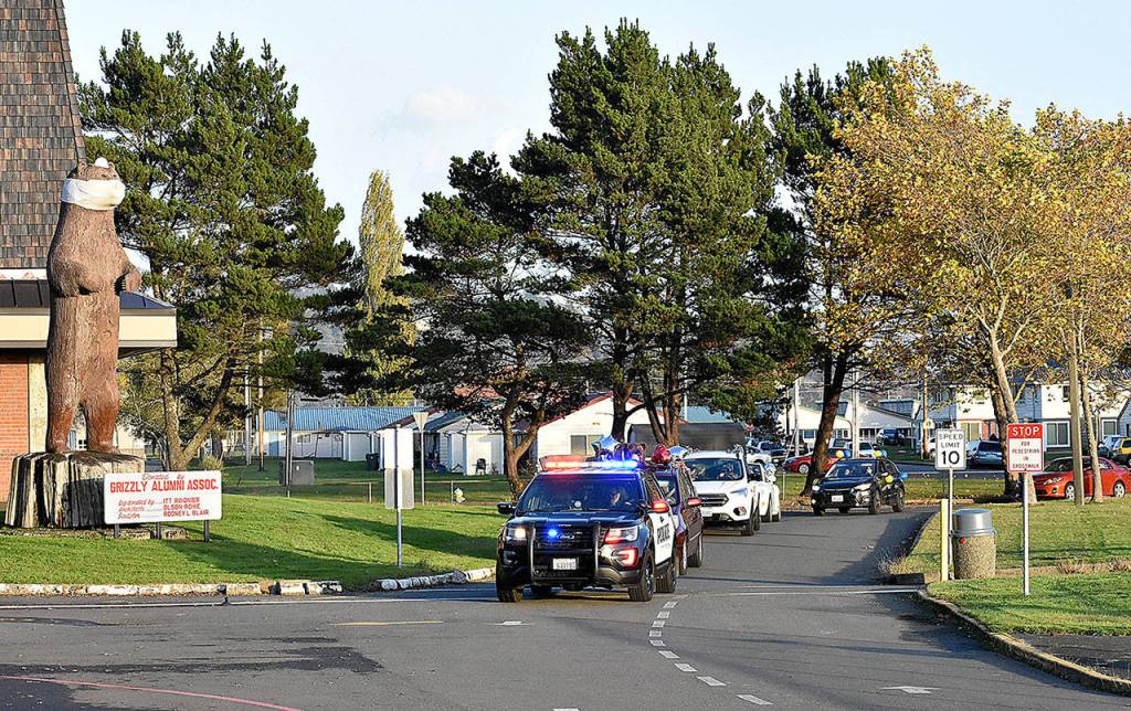 (Richelle Barger) The Oct. 30 Food Ball kickoff parade begins at Hoquiam High School, led by Hoquiam Police office Bob Green.