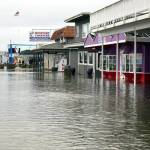 Storefronts along Westhaven Drive in the Westport marina district experienced some flooding after an approximate 20-foot wave hit the area on Sunday. (Photo by Jeff Pence)