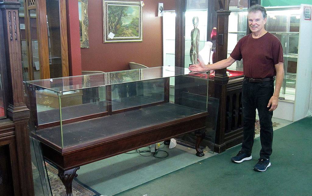 JOHN LARSON | POLSON MUSEUM 
Richard Mirau with one of the six vintage display cases he donated to the Polson Museum Nov. 6.
