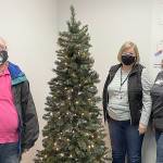 COURTESY PHOTO 
The Aberdeen Police Department giving tree was placed Nov. 23. Its ornaments include wishes from local kids, which the public can take to fulfill, then the department will wrap and deliver the gift. Pictured from left are volunteers Stacy Watson, Carol Winter and Julie Swor.