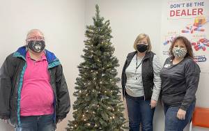 COURTESY PHOTO 
The Aberdeen Police Department giving tree was placed Nov. 23. Its ornaments include wishes from local kids, which the public can take to fulfill, then the department will wrap and deliver the gift. Pictured from left are volunteers Stacy Watson, Carol Winter and Julie Swor.
