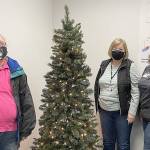 COURTESY PHOTO 
The Aberdeen Police Department giving tree was placed Nov. 23. Its ornaments include wishes from local kids, which the public can take to fulfill, then the department will wrap and deliver the gift. Pictured from left are volunteers Stacy Watson, Carol Winter and Julie Swor.