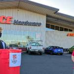 North Beach High School Student Bodie Skinner, left, poses for a photo with Ace Hardware/Buck Electrics Joe Buck during the North Beach High School Food Bowl in December. (Submitted photo)