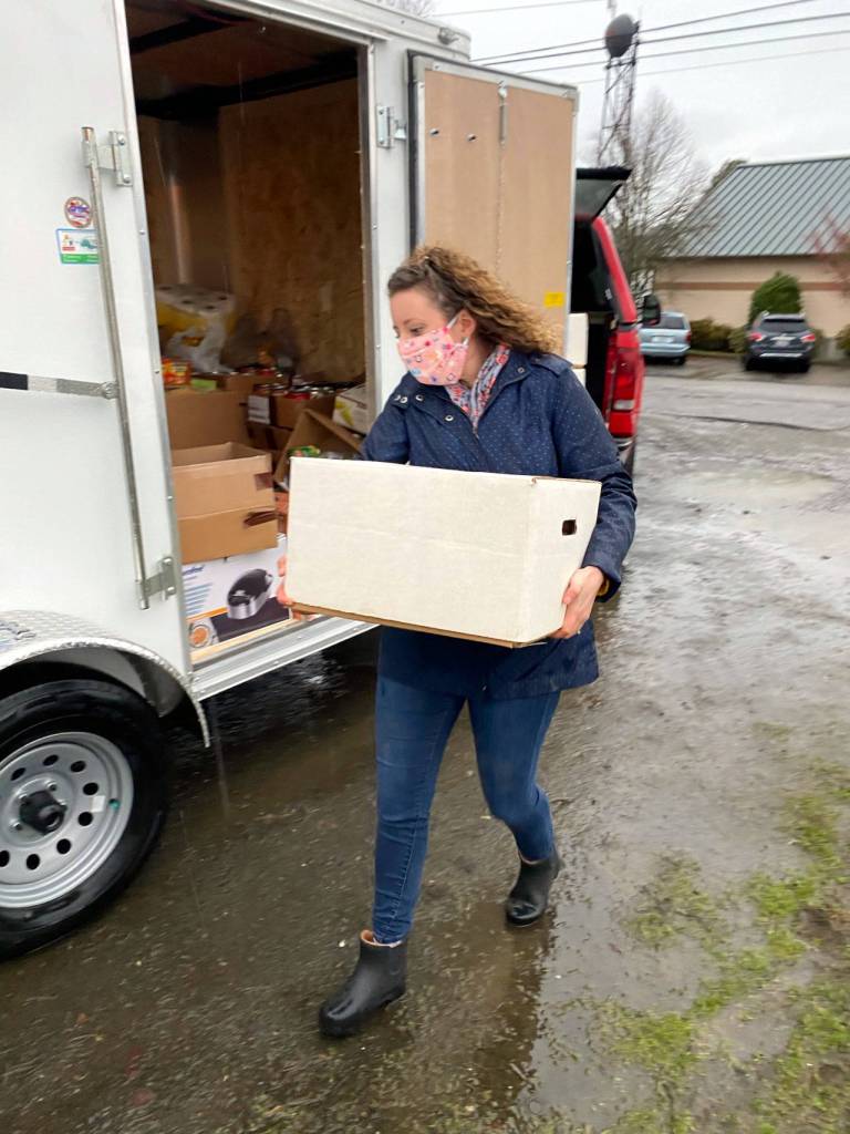 Elma ASB Advisor and Food Bowl Director Emily Severs transports a box of food during Elma School Districts Food & Money Drive in November. (Submitted photo)