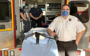 South Beach Regional Fire Authority Battalion Chief Daryl Brown stands alongside one of the new power lift gurneys the department was able to purchase with a grant from the federal Assistance to Firefighters grant program.
COURTESY PHOTO