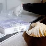 A tray of 975 doses of Pfizers coronavirus vaccine goes into the deep freeze after the vaccine arrived at UW Medicines Montlake campus Monday morning.