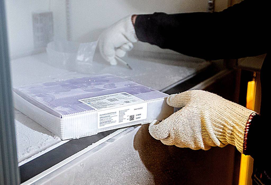 A tray of 975 doses of Pfizers coronavirus vaccine goes into the deep freeze after the vaccine arrived at UW Medicines Montlake campus Monday morning.