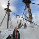 Kat Bryant | The Daily World
Brandi Bednarik, executive director of the Grays Harbor Historical Seaport, stands in front of the downrigged Lady Washington.