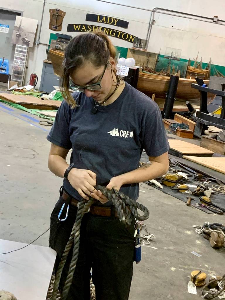 Crew member Tanith Anhaiser fortifies a strop for the Lady Washington. (Kat Bryant | The Daily World)