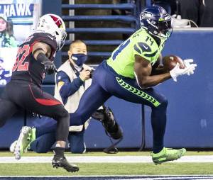 Bettina Hansen / The Seattle Times 
Seattle Seahawks wide receiver DK Metcalf made his first Pro Bowl. He is fourth in the NFL with 1,223 yards receiving and 16.5 yards per catch. He has 10 touchdowns in 14 games. He needs 65 yards Sunday in the Seahawks home game against the Los Angeles Rams for the NFC West title to break Steve Largents team record for yards receiving in a season.