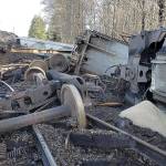 RYAN SPARKS / THE DAILY WORLD 
Six boxcars carrying grain derailed Monday afternoon in Montesano. Crews were working to upright and remove the cars Tuesday morning.