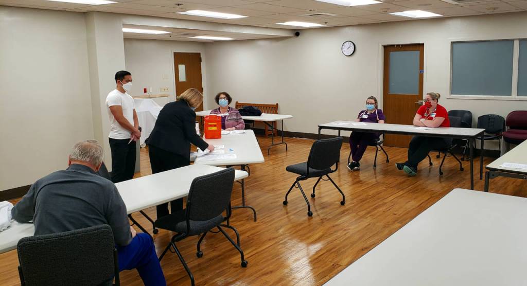 Conference Room C at Grays Harbor Community Hospital saw a steady stream of frontline healthcare workers during the first day of COVID-19 vaccinations on Tuesday in Aberdeen. (Ryan Sparks | The Daily World)