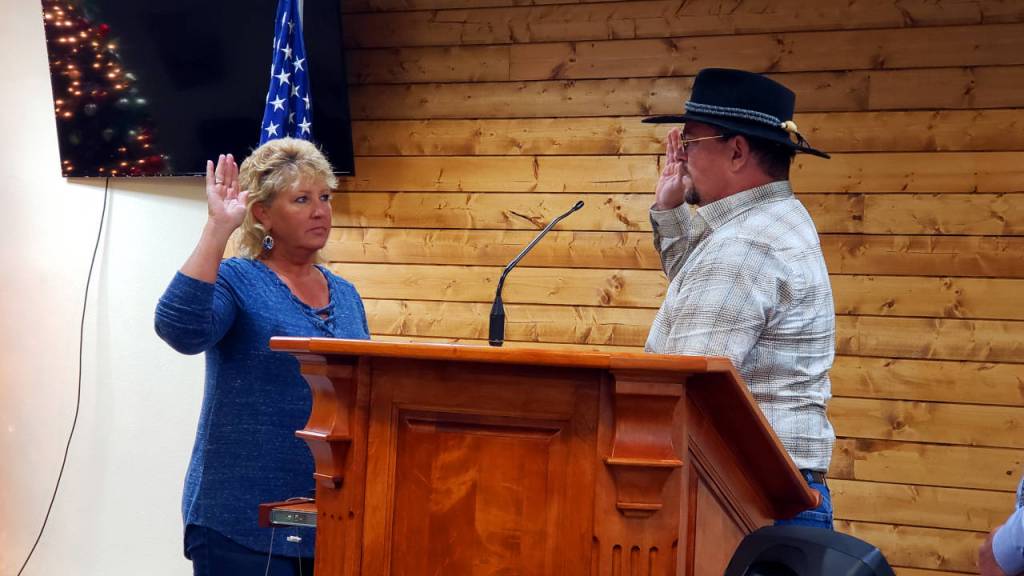 Jill Warne, left, is sworn in as Grays Harbor County Commissioner by county auditor Joesph MacLean during an inauguration ceremony on Tuesday in Aberdeen. (Ryan Sparks | The Daily World)