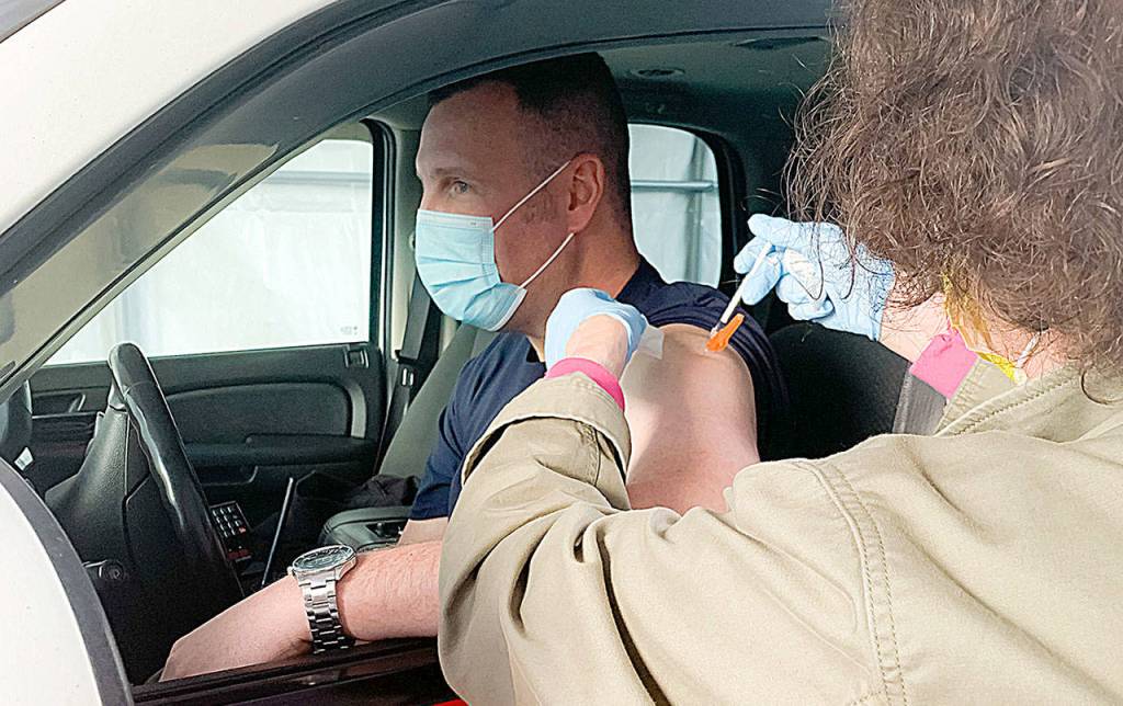 COURTESY GRAYS HARBOR COMMUNITY HOSPITAL 
A Montesano first responder receives a first dose of the Pfizer COVID-19 vaccine at Grays Harbor Community Hospital.
