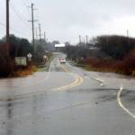 Some minor flooding creeps up onto the edge of State Route 109 near the Moclips River on Monday. Water on the roadway caused the route to be closed in both directions near Ocean City at 12:30 p.m. (Photo by Elizabeth Berg)